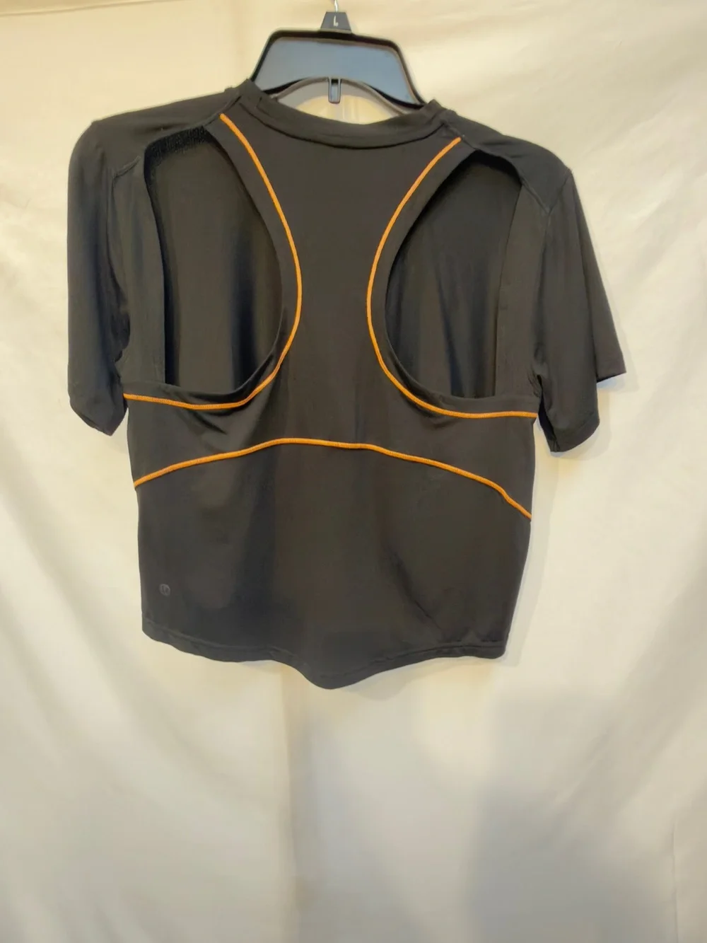 Lululemon Ventilated Open-Back Training T-Shirt in Black with Orange Soda trim